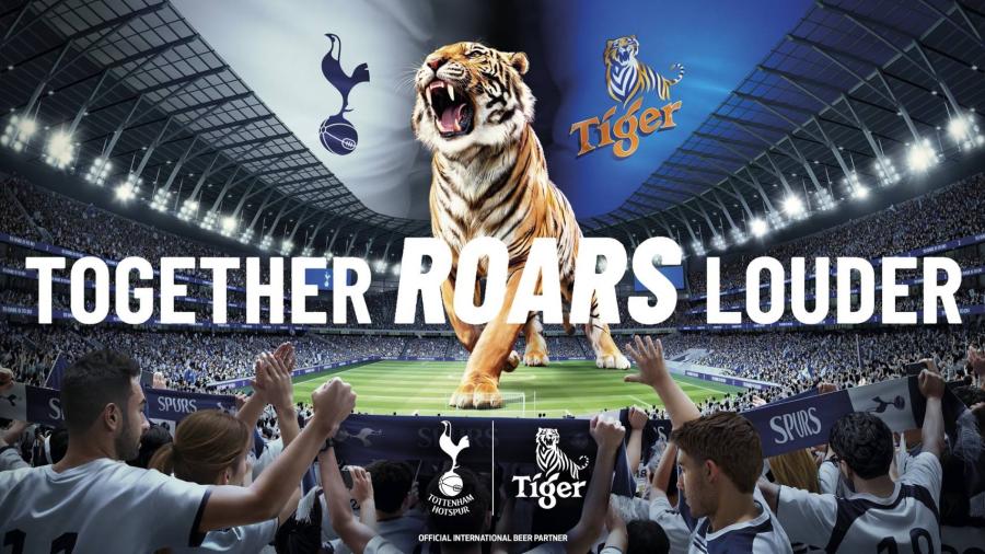 Tiger® เสริมแกร่ง Sport Marketing ประกาศจับมือสโมสรฟุตบอล Tottenham Hotspur พร้อมเติมสีสันการเชียร์บอลให้กับแฟนๆ ทั่วโลก ความร่วมมือกับสโมสรฟุตบอลระดับโลกสะท้อนถึงจุดมุ่งหมายของแบรนด์ Tiger® ในการส่งเสริมและสร้างความก้าวหน้าให้กับวงการฟุตบอล สอดคล้องกับความเชื่อที่ว่าความสำเร็จไม่ได้มาจากคนเพียงคนเดียว Tiger® เสริมแกร่ง Sport Marketing ประกาศจับมือสโมสรฟุตบอล Tottenham Hotspur พร้อมเติมสีสันการเชียร์บอลให้กับแฟนๆ ทั่วโลก ความร่วมมือกับสโมสรฟุตบอลระดับโลกสะท้อนถึงจุดมุ่งหมายของแบรนด์ Tiger® ในการส่งเสริมและสร้างความก้าวหน้าให้กับวงการฟุตบอล สอดคล้องกับความเชื่อที่ว่าความสำเร็จไม่ได้มาจากคนเพียงคนเดียว